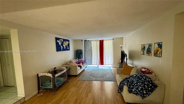 3660 Inverrary Dr Unit 2W, Lauderhill, FL 33319 - living room featuring a textured ceiling and wood finished floors