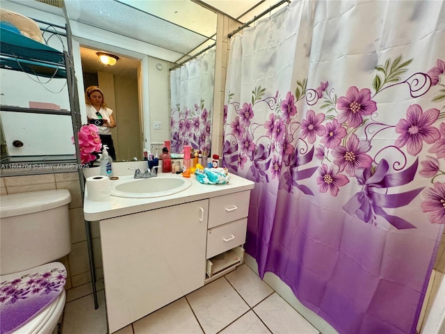3660 Inverrary Dr Unit 2W, Lauderhill, FL 33319 - full bathroom featuring toilet, vanity, and tile patterned floors