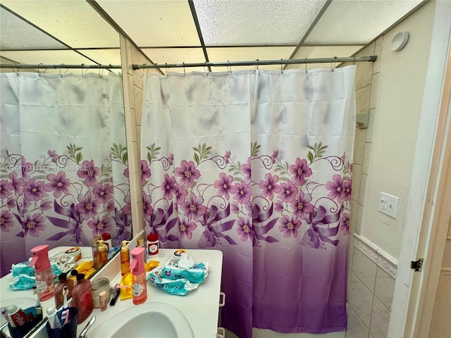 3660 Inverrary Dr Unit 2W, Lauderhill, FL 33319 - bathroom with a drop ceiling and tile walls