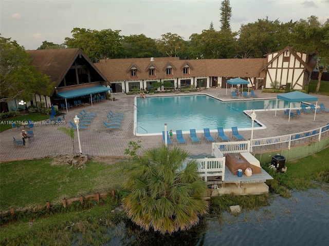 3660 Inverrary Dr Unit 2W, Lauderhill, FL 33319 - community pool featuring a patio and fence