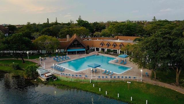 3660 Inverrary Dr Unit 2W, Lauderhill, FL 33319 - community pool featuring a water view and a patio