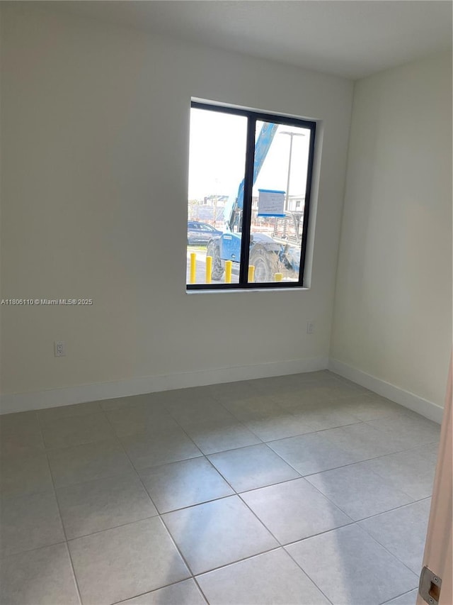 8001NW 41st St Unit F-108, Doral, FL 33166 - empty room with light tile patterned floors and baseboards