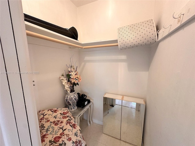 spacious closet featuring tile patterned flooring