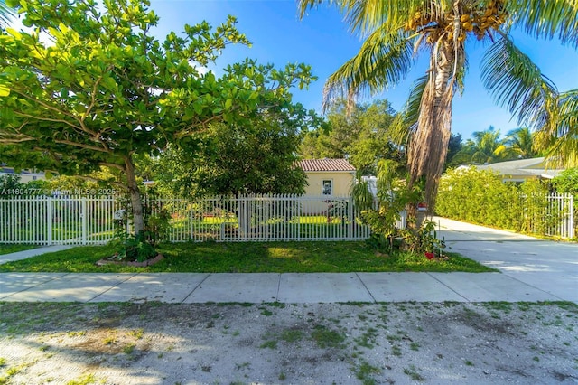 view of front facade with a fenced front yard and stucco siding