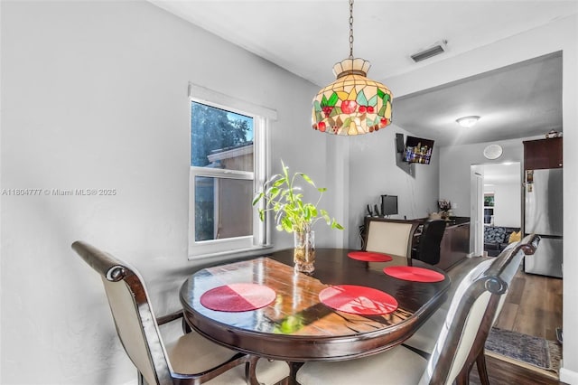 dining room with wood finished floors