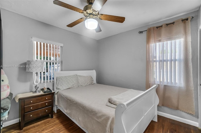 bedroom with wood finished floors, ceiling fan, and baseboards