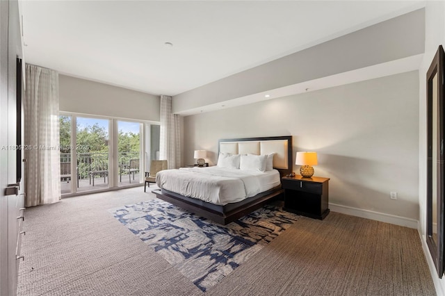 carpeted bedroom with baseboards