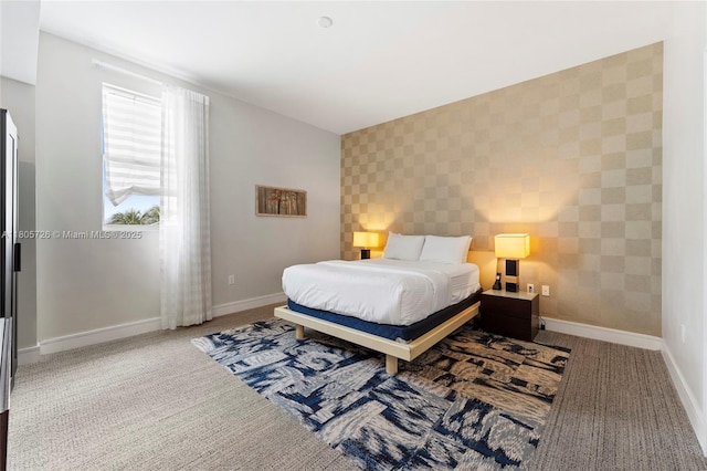 bedroom featuring carpet flooring, wallpapered walls, and baseboards