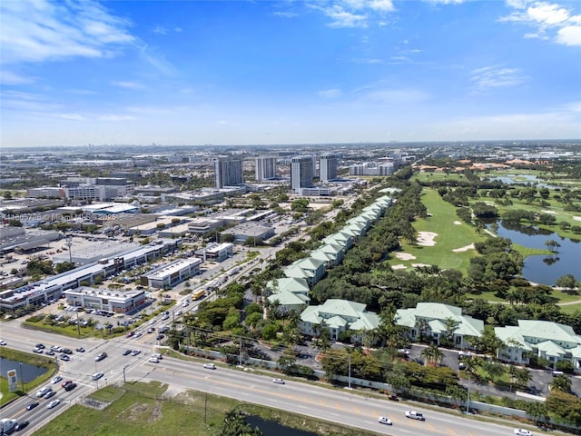 bird's eye view of a nearby body of water and a local golf course