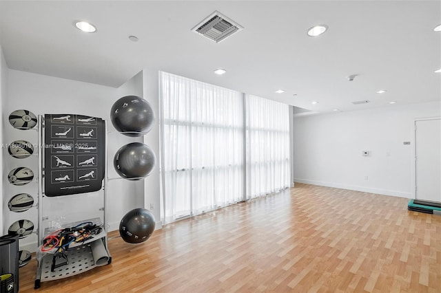 350 NE 24th St Unit 714, Miami, FL 33137 - exercise room featuring light wood-style flooring, baseboards, and recessed lighting