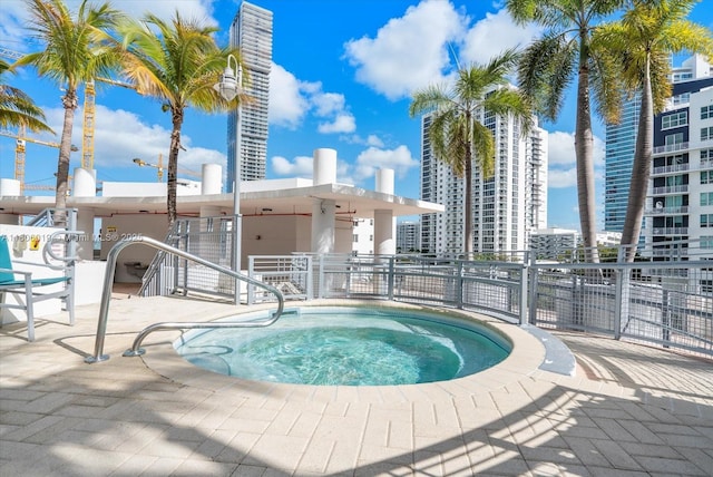 350 NE 24th St Unit 714, Miami, FL 33137 - view of swimming pool with a community hot tub, fence, and a patio