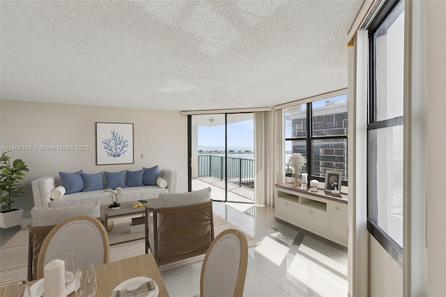 1901 Brickell Ave Unit B1408, Miami, FL 33129 - living area featuring a textured ceiling, floor to ceiling windows, and light tile patterned floors