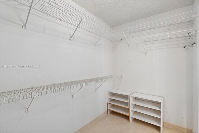 1901 Brickell Ave Unit B1408, Miami, FL 33129 - spacious closet with light tile patterned floors