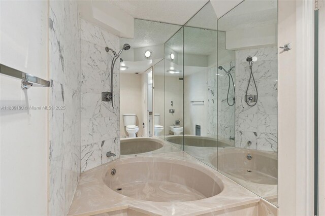 1901 Brickell Ave Unit B1408, Miami, FL 33129 - full bath with toilet, a tub with marble appearance, a bidet, and a shower
