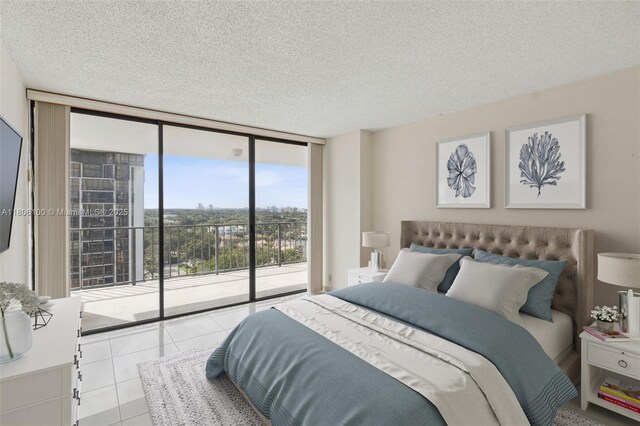 1901 Brickell Ave Unit B1408, Miami, FL 33129 - tiled bedroom with a wall of windows, access to outside, and a textured ceiling