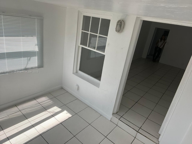 126 NW 13th Ave, Dania Beach, FL 33004 - empty room featuring light tile patterned floors and baseboards