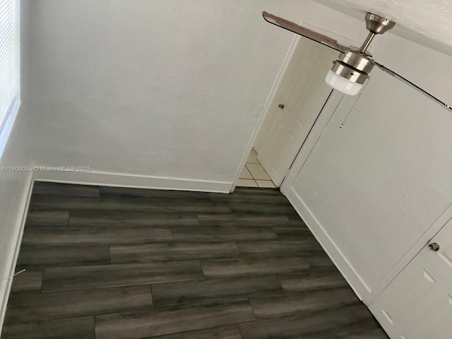 126 NW 13th Ave, Dania Beach, FL 33004 - unfurnished dining area featuring dark wood-style floors and baseboards