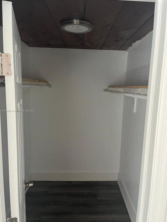 126 NW 13th Ave, Dania Beach, FL 33004 - spacious closet featuring dark wood-type flooring