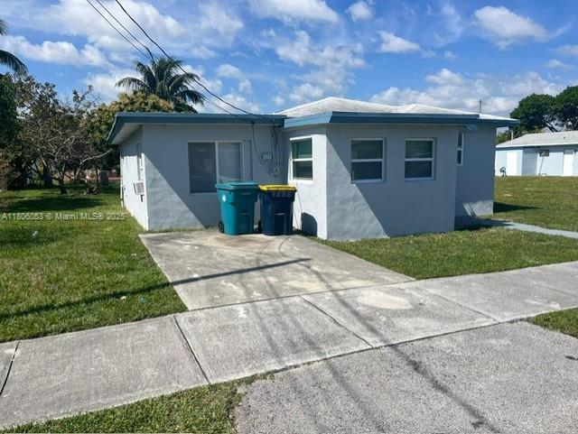 126 NW 13th Ave, Dania Beach, FL 33004 - view of outdoor structure featuring driveway