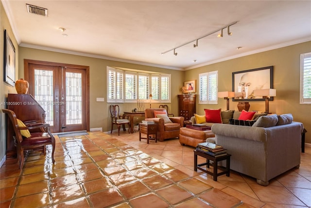 5020 SW 82nd Ave, Miami, FL 33155 - living room with rail lighting, healthy amount of natural light, light tile patterned flooring, french doors, and crown molding