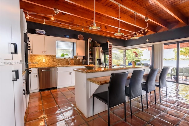 5020 SW 82nd Ave, Miami, FL 33155 - kitchen featuring appliances with stainless steel finishes, wooden ceiling with exposed beams, white cabinets, a sink, and decorative backsplash