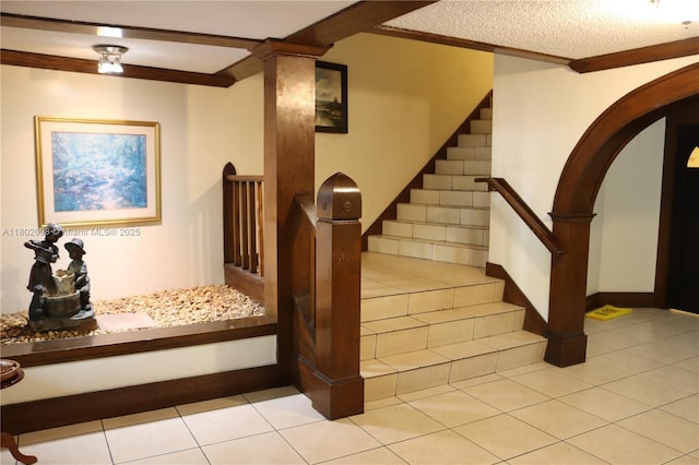 3730 Inverrary Dr Unit 2Y, Lauderhill, FL 33319 - staircase featuring arched walkways, tile patterned flooring, and a textured ceiling