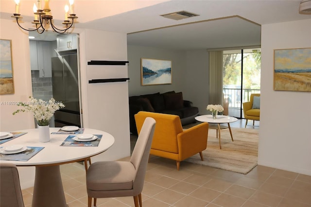 3730 Inverrary Dr Unit 2Y, Lauderhill, FL 33319 - dining space featuring a chandelier and light tile patterned flooring