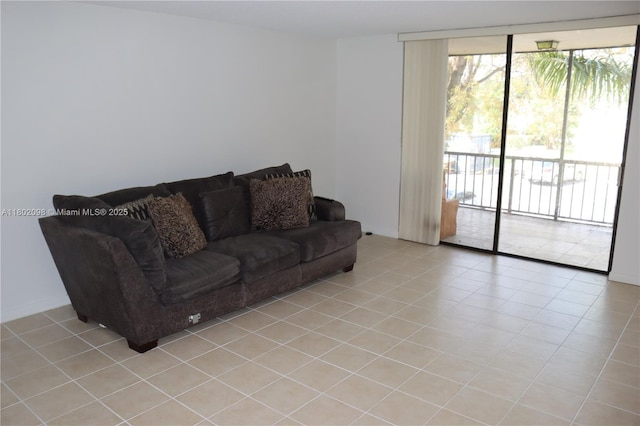 3730 Inverrary Dr Unit 2Y, Lauderhill, FL 33319 - living area with a wall of windows and light tile patterned floors