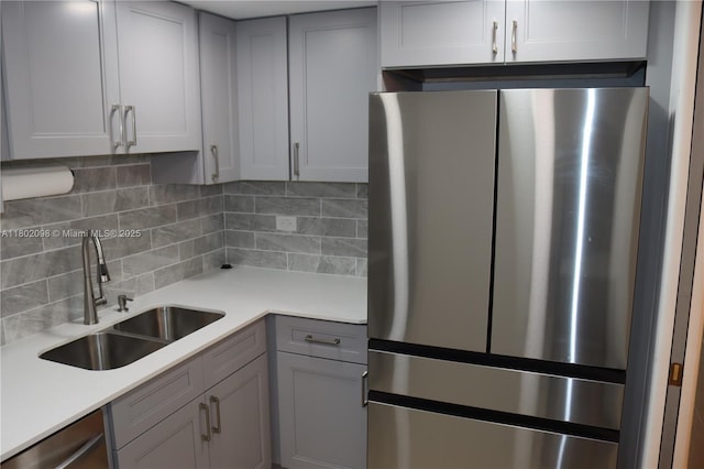 3730 Inverrary Dr Unit 2Y, Lauderhill, FL 33319 - kitchen with stainless steel appliances, a sink, tasteful backsplash, and light countertops