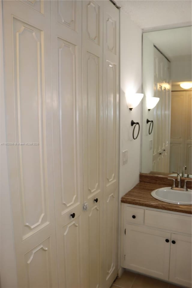 3730 Inverrary Dr Unit 2Y, Lauderhill, FL 33319 - bathroom with vanity and a closet