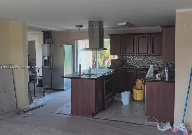 884 Montego Dr, West Palm Beach, FL 33415 - kitchen featuring stainless steel refrigerator with ice dispenser, island exhaust hood, dark countertops, a center island, and backsplash