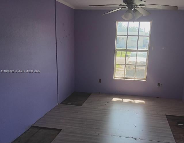 884 Montego Dr, West Palm Beach, FL 33415 - spare room with a ceiling fan and wood finished floors