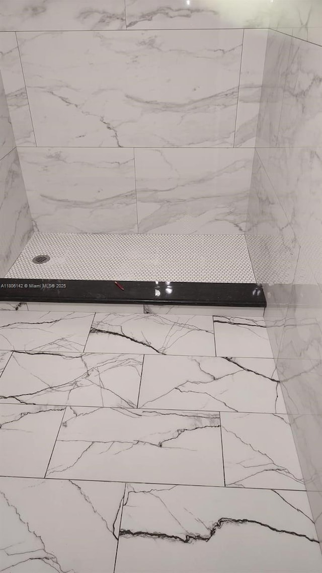884 Montego Dr, West Palm Beach, FL 33415 - bathroom view of a tile shower