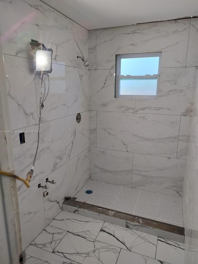 884 Montego Dr, West Palm Beach, FL 33415 - bathroom with a marble finish shower and marble look tile flooring