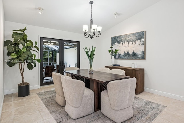 7935 SW 155th St, Palmetto Bay, FL 33157 - dining room featuring french doors, a chandelier, lofted ceiling, light tile patterned floors, and baseboards