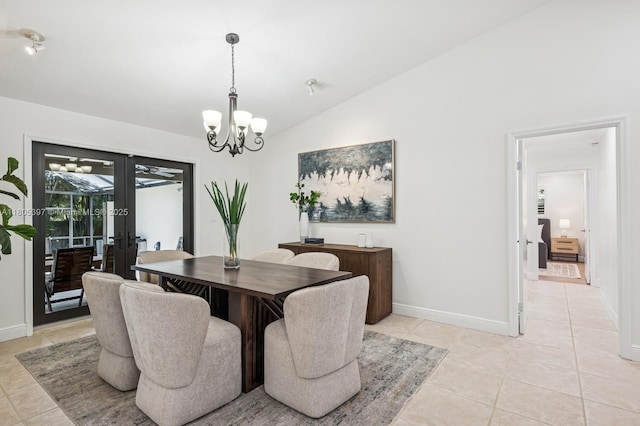 7935 SW 155th St, Palmetto Bay, FL 33157 - dining room with french doors, light tile patterned flooring, lofted ceiling, a chandelier, and baseboards