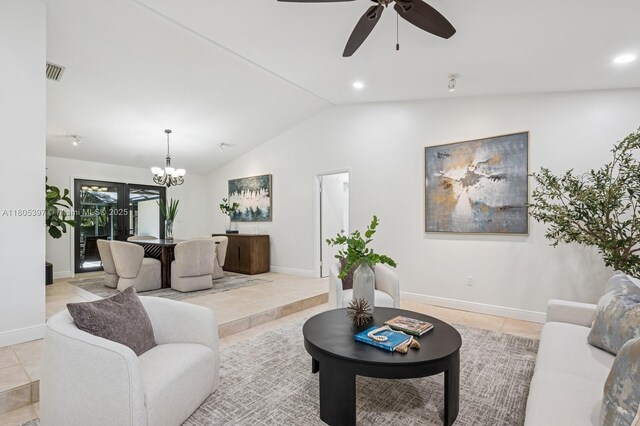 7935 SW 155th St, Palmetto Bay, FL 33157 - living room featuring a chandelier, vaulted ceiling, ceiling fan, light tile patterned floors, and baseboards