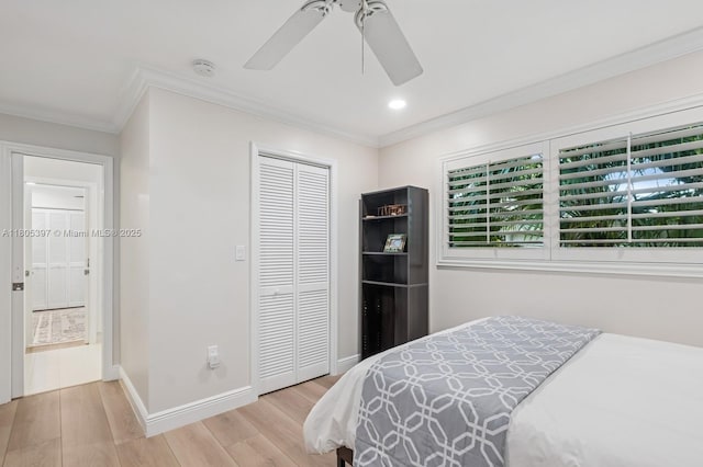 7935 SW 155th St, Palmetto Bay, FL 33157 - bedroom with ornamental molding, wood finished floors, a closet, baseboards, and a ceiling fan