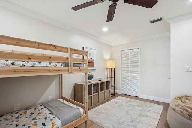 7935 SW 155th St, Palmetto Bay, FL 33157 - bedroom featuring ornamental molding, wood finished floors, a closet, baseboards, and ceiling fan