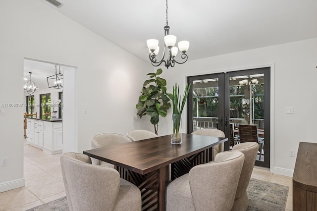 7935 SW 155th St, Palmetto Bay, FL 33157 - dining space featuring a chandelier, plenty of natural light, french doors, light tile patterned floors, and vaulted ceiling