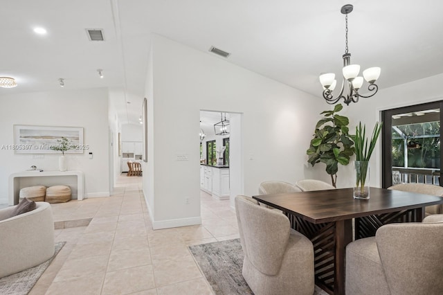 7935 SW 155th St, Palmetto Bay, FL 33157 - dining area with a chandelier, light tile patterned floors, and baseboards
