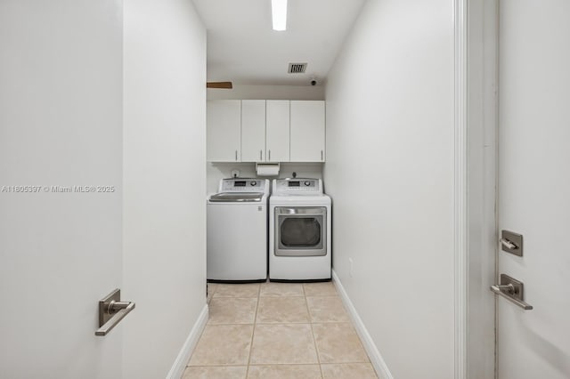 7935 SW 155th St, Palmetto Bay, FL 33157 - laundry area with cabinet space, independent washer and dryer, light tile patterned floors, and baseboards