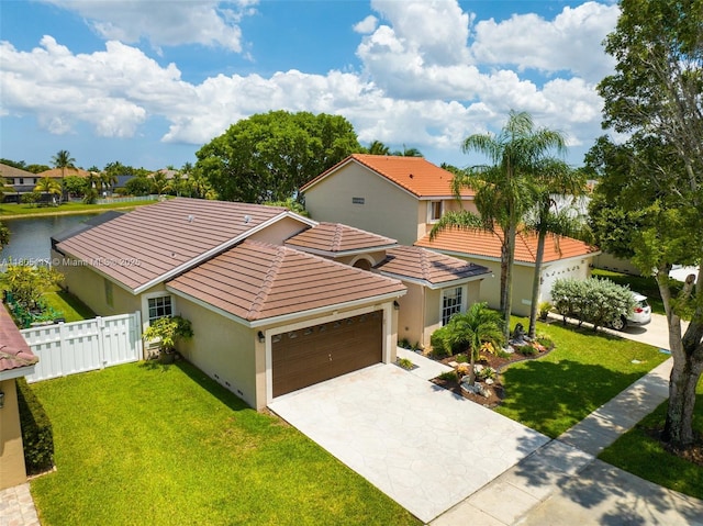 921 SW 176th Ave, Pembroke Pines, FL 33029 - mediterranean / spanish house with an attached garage, stucco siding, a tiled roof, driveway, and a residential view