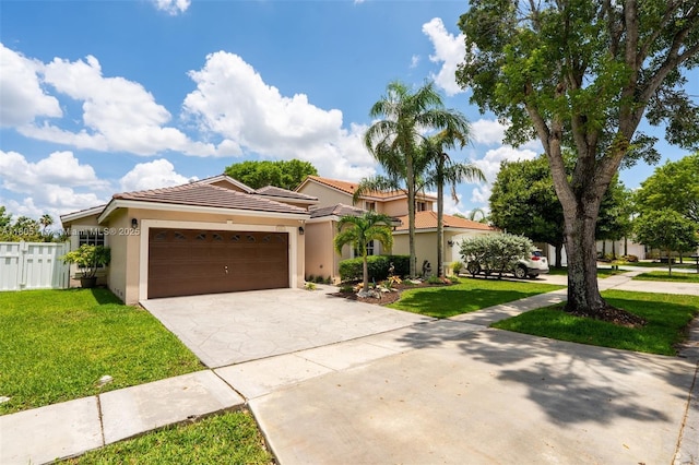 921 SW 176th Ave, Pembroke Pines, FL 33029 - mediterranean / spanish house featuring driveway, stucco siding, a tiled roof, and an attached garage