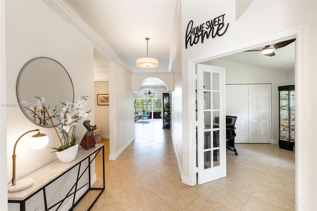 921 SW 176th Ave, Pembroke Pines, FL 33029 - hall with a desk, light tile patterned floors, arched walkways, baseboards, and crown molding