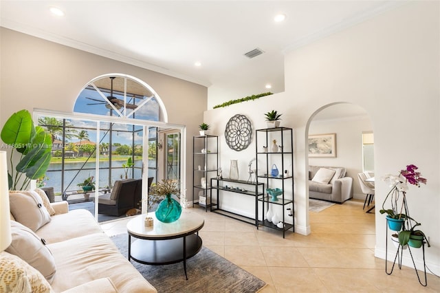 921 SW 176th Ave, Pembroke Pines, FL 33029 - living room with light tile patterned floors, crown molding, recessed lighting, arched walkways, and baseboards
