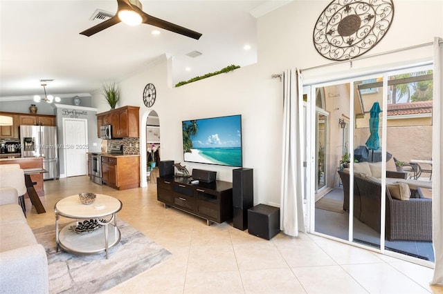 921 SW 176th Ave, Pembroke Pines, FL 33029 - living room featuring ornamental molding, ceiling fan, light tile patterned floors, arched walkways, and vaulted ceiling