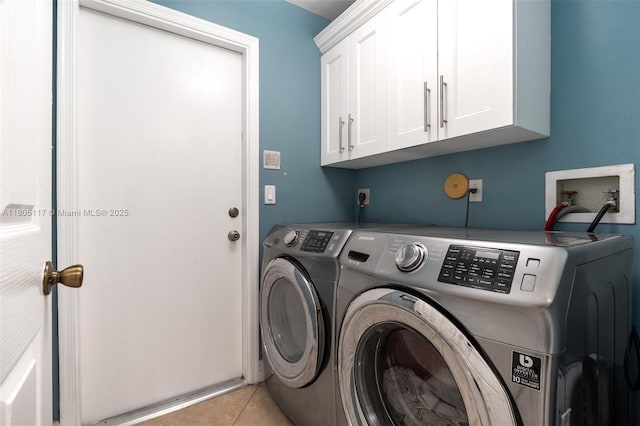 921 SW 176th Ave, Pembroke Pines, FL 33029 - laundry area featuring washer and clothes dryer, cabinet space, and light tile patterned flooring