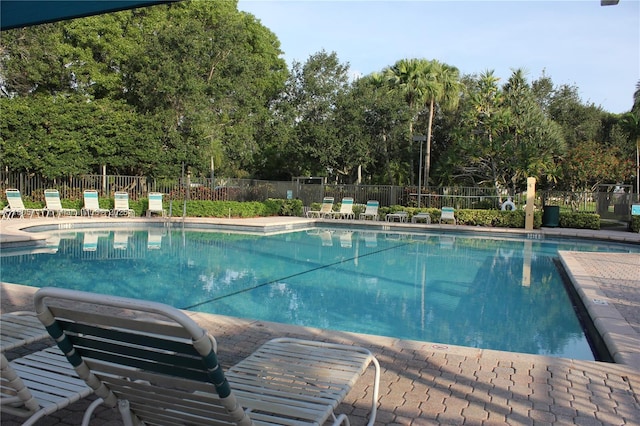 921 SW 176th Ave, Pembroke Pines, FL 33029 - community pool featuring view of scattered trees and a patio area