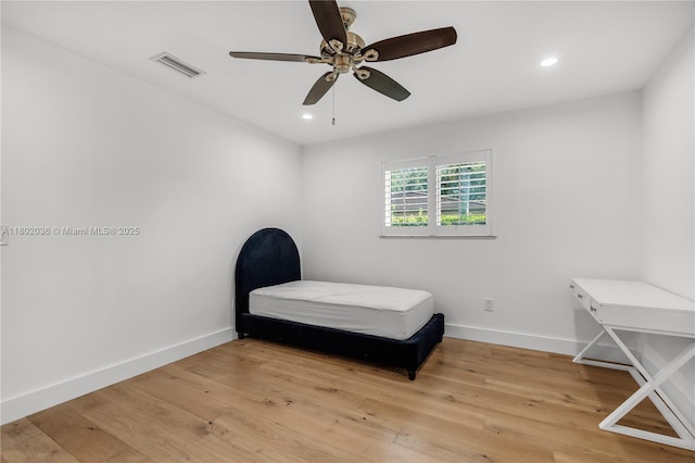 bedroom featuring light wood-type flooring, baseboards, recessed lighting, and a ceiling fan
